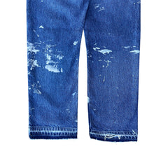 Load image into Gallery viewer, Vintage Paint Splattered Released Hem Levis 505 Jeans
