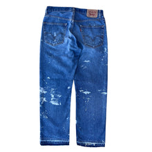 Load image into Gallery viewer, Vintage Paint Splattered Released Hem Levis 505 Jeans
